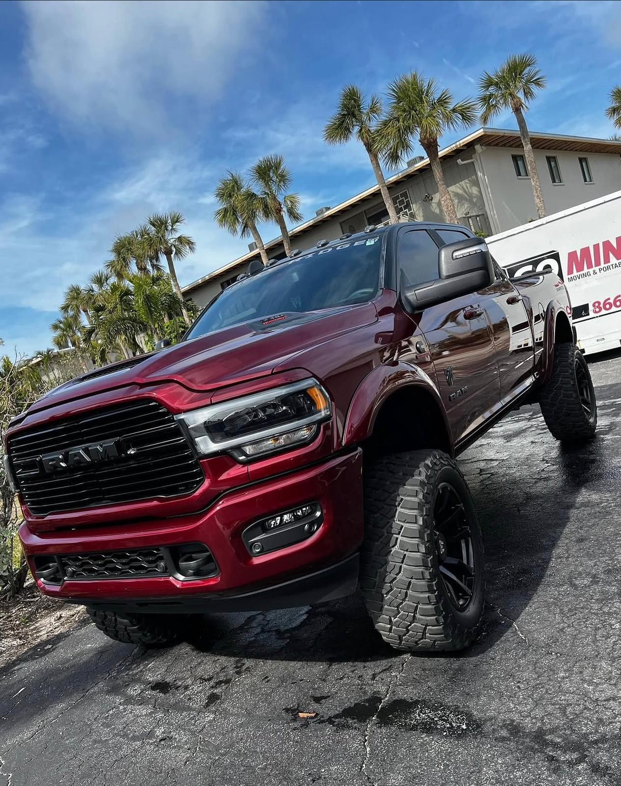 Maroon Ram pickup with off-road tires detailed